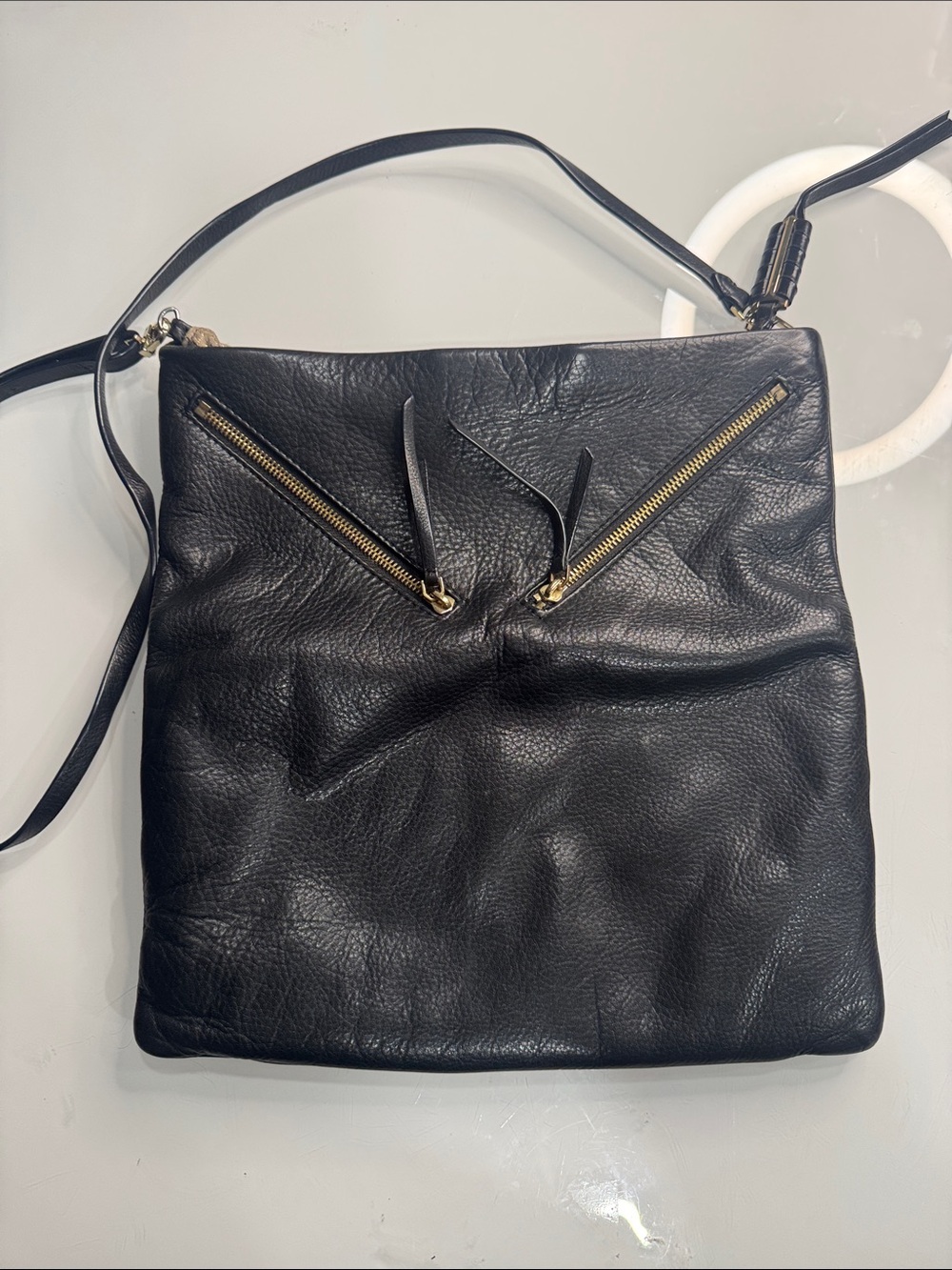 Covet Black Leather Crossbody with Gold Zipper Accents